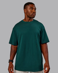 Man wearing Variation FLXCotton Oversized Tee in Dark Moss-Digital Mist | Size:M | Thumbnail Index: 3