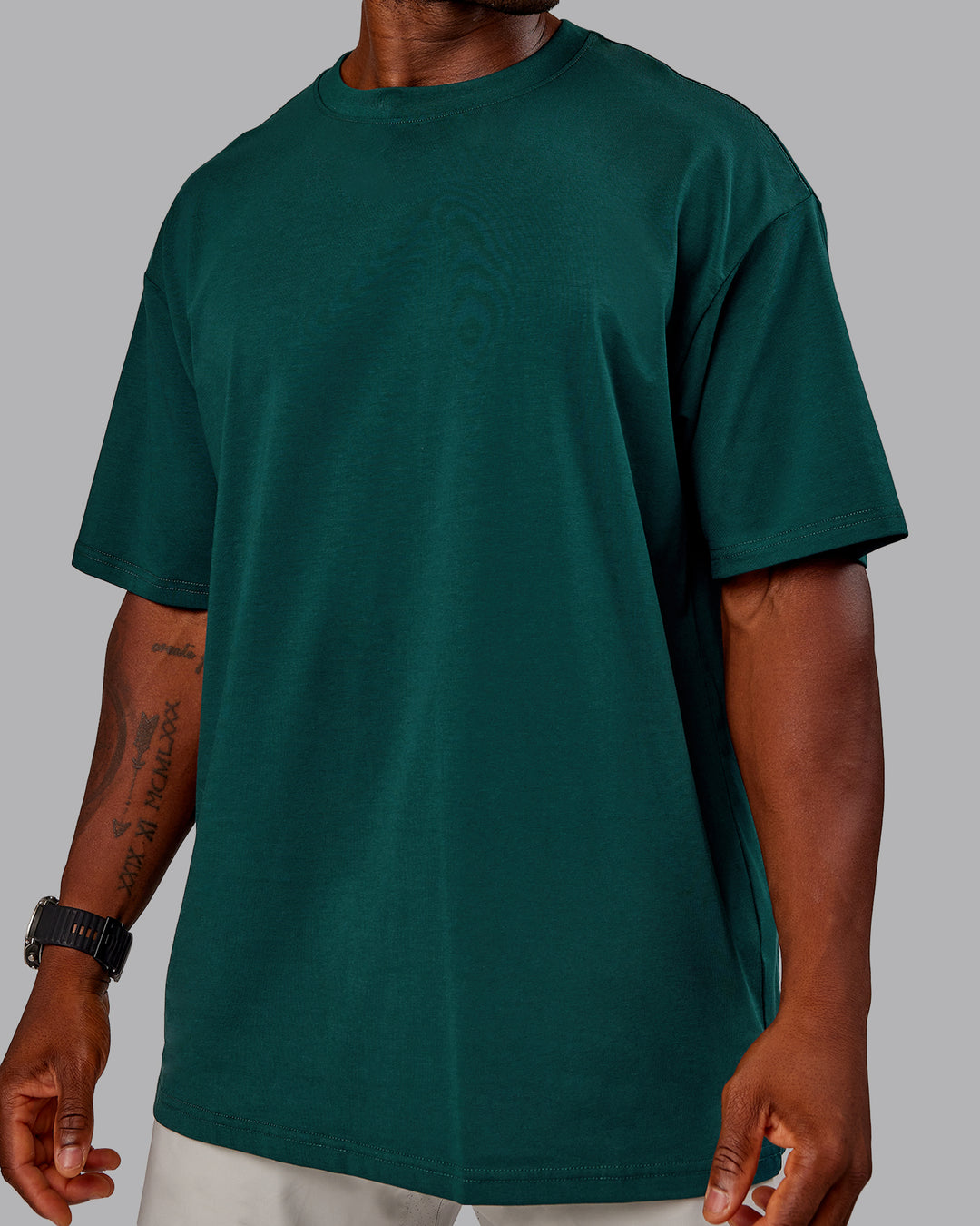 Man wearing Variation FLXCotton Oversized Tee in Dark Moss-Digital Mist | Size:M - view 9