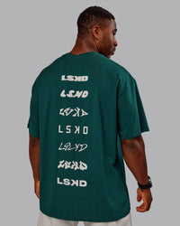 Man wearing Variation FLXCotton Oversized Tee in Dark Moss-Digital Mist | Size:M | Thumbnail Index: 9