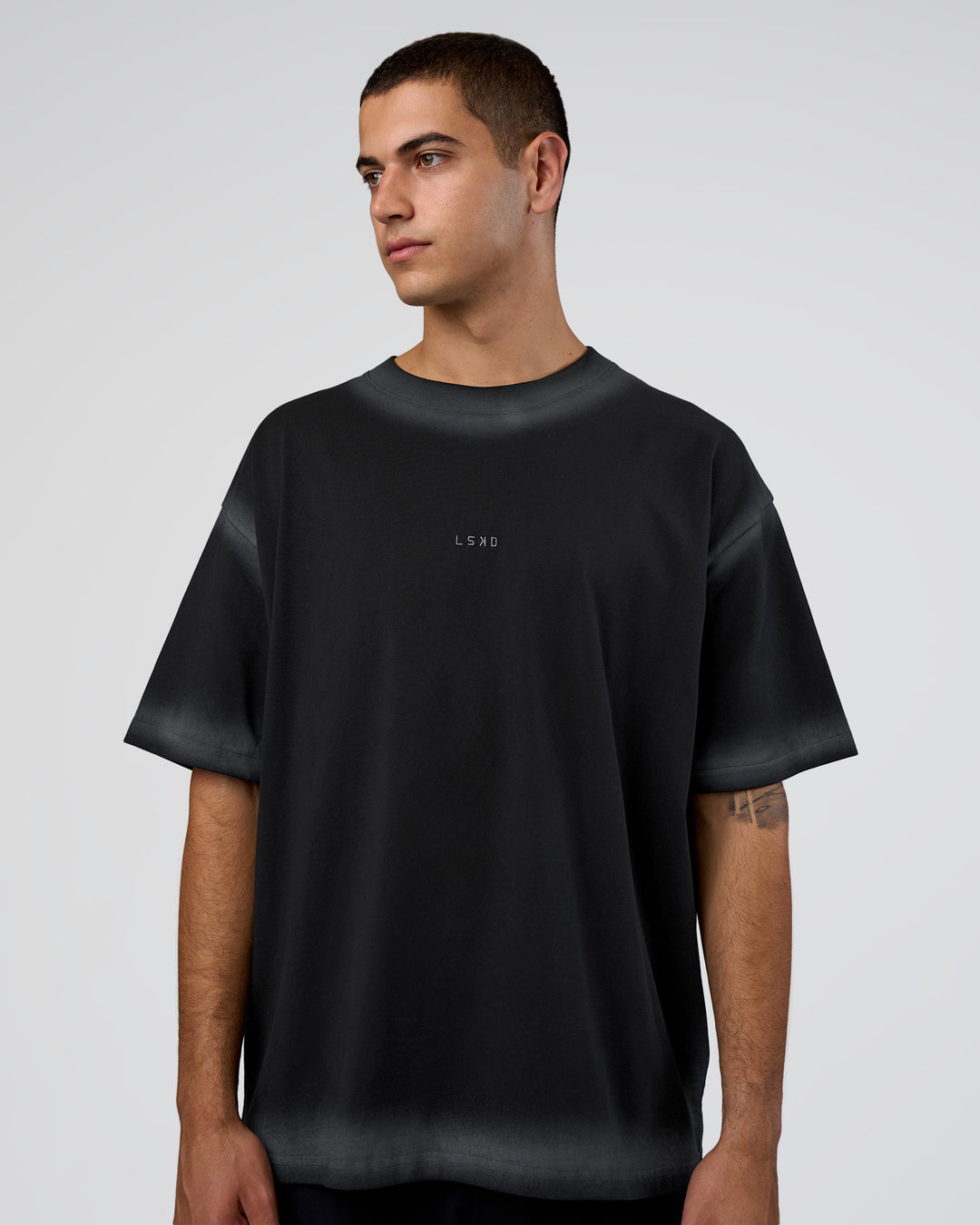 Man wearing Urban Blur Heavyweight Unisex Oversized Tee - Black-Dark Storm | Model:Zoran | Size:M - view 1