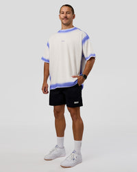 Man wearing Urban Blur Heavyweight Unisex Oversized Tee - Off White-Power Cobalt | Model:Jaiden | Size:M | Thumbnail Index: 2