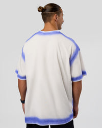 Man wearing Urban Blur Heavyweight Unisex Oversized Tee - Off White-Power Cobalt | Model:Jaiden | Size:M | Thumbnail Index: 5