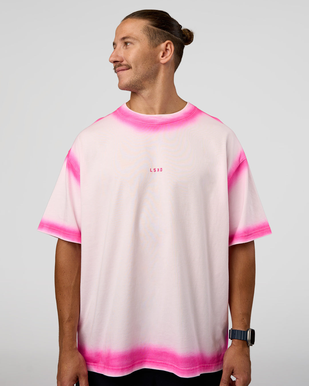 Man wearing Urban Blur Heavyweight Unisex Oversized Tee - Off White-Ultra Pink | Model:Jaiden | Size:M - view 11