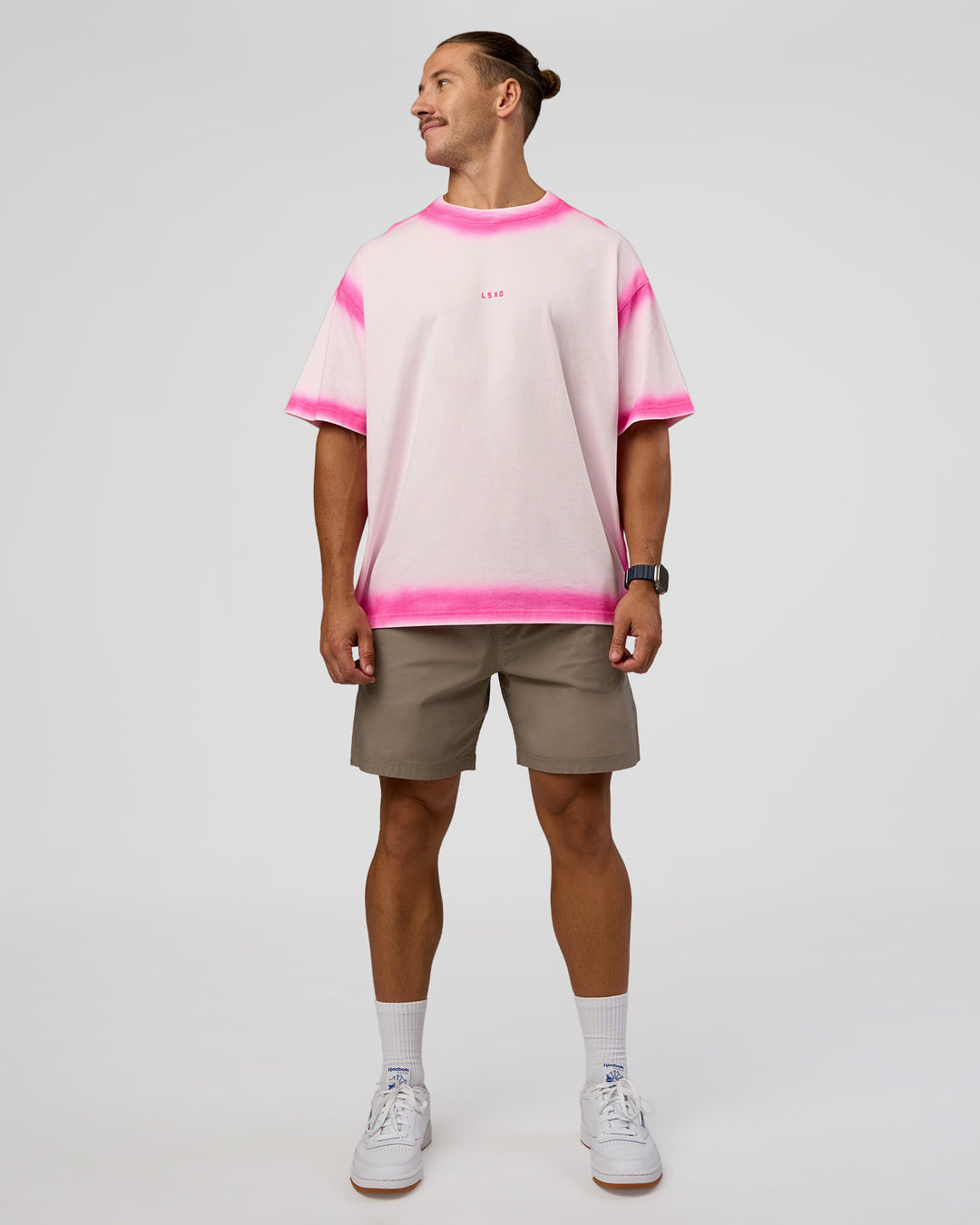 Man wearing Urban Blur Heavyweight Unisex Oversized Tee - Off White-Ultra Pink | Model:Jaiden | Size:M - view 10