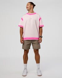 Man wearing Urban Blur Heavyweight Unisex Oversized Tee - Off White-Ultra Pink | Model:Jaiden | Size:M | Thumbnail Index: 9
