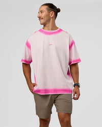 Man wearing Urban Blur Heavyweight Unisex Oversized Tee - Off White-Ultra Pink | Model:Jaiden | Size:M | Thumbnail Index: 1