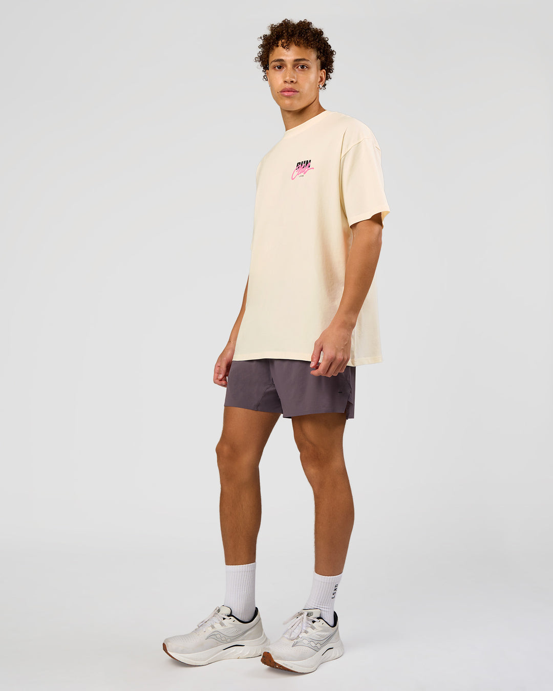 Man wearing Values Run Club FLXCotton Tee - Off White-Candy Pink | Model:Leandro | Size:M - view 6