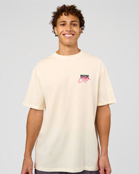 Man wearing Values Run Club FLXCotton Tee - Off White-Candy Pink | Model:Leandro | Size:M | Thumbnail Index: 2