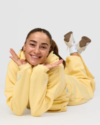 Woman wearing Zola Oversized Hoodie - Lemon | Model:Grace | Size:M | Thumbnail Index: 11
