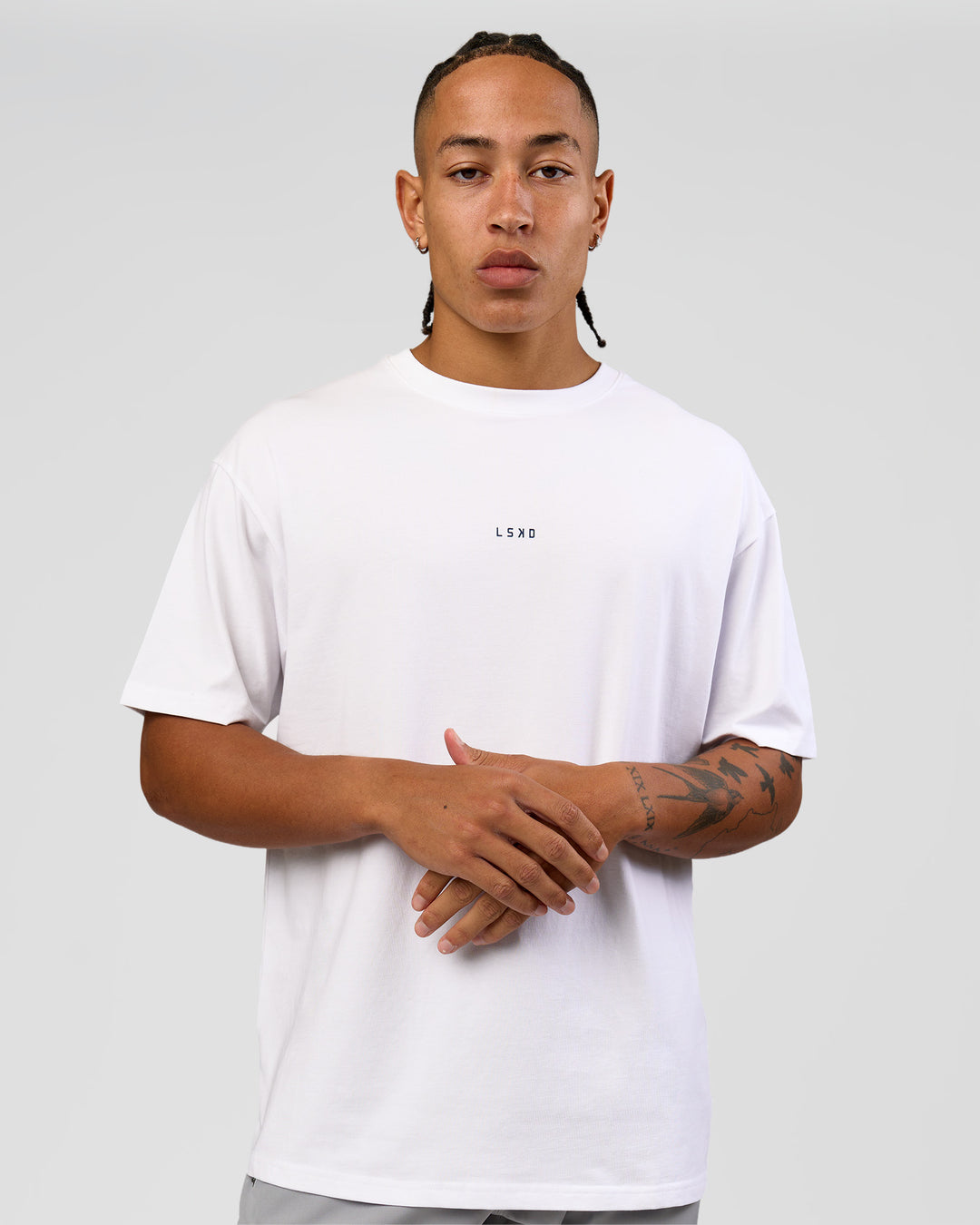 Man wearing Run Like The Wind FLXCotton Oversized Tee - White-Future Navy | Model:Malebo | Size:M - view 4