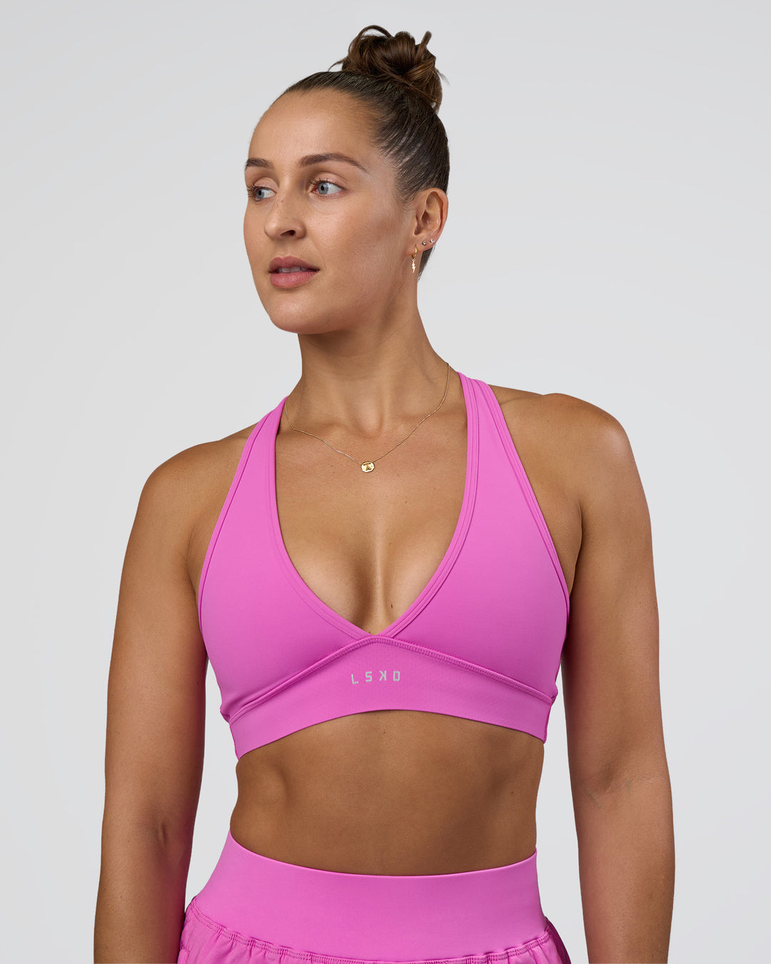 Woman wearing Stamina Sports Bra - Ultra Fuchsia | Set:true | Angle:front | Model:Abbey | Size:M - view 1
