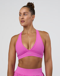 Woman wearing Stamina Sports Bra - Ultra Fuchsia | Set:true | Angle:front | Model:Abbey | Size:M | Thumbnail Index: 0