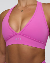 Woman wearing Stamina Sports Bra - Ultra Fuchsia | Set:true | Angle:closeup | Model:Abbey | Size:M | Thumbnail Index: 5