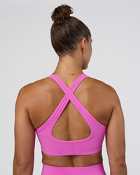 Woman wearing Stamina Sports Bra - Ultra Fuchsia | Set:true | Angle:back | Model:Abbey | Size:M | Thumbnail Index: 4