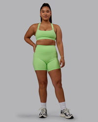 Woman wearing Bree Masters Fusion Ultra High-Rise 6" Short Pockets - Pastel Lime | Thumbnail Index: 8