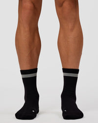 Man wearing Run Club Fast Performance Socks 2.0 - Black-Reflective | Thumbnail Index: 5