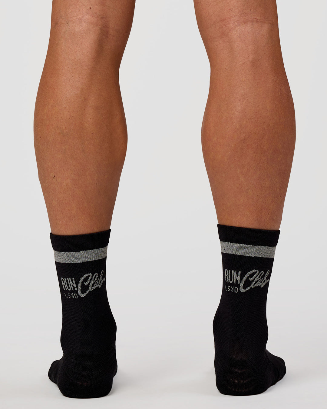 Man wearing Run Club Fast Performance Socks 2.0 - Black-Reflective - view 3