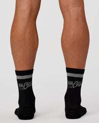 Man wearing Run Club Fast Performance Socks 2.0 - Black-Reflective | Thumbnail Index: 2