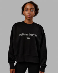 Woman wearing 1% Better Heavyweight Sweater - Black-White | Thumbnail Index: 0