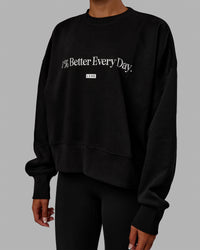 Woman wearing 1% Better Heavyweight Sweater - Black-White | Thumbnail Index: 2