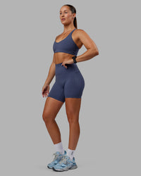 Woman wearing Abs Elixir Ultra High-Rise 6" Short Pockets - Nightshadow Blue | Thumbnail Index: 4