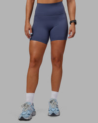 Woman wearing Abs Elixir Ultra High-Rise 6" Short Pockets - Nightshadow Blue | Thumbnail Index: 0