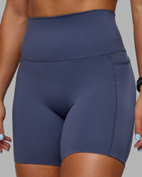 Woman wearing Abs Elixir Ultra High-Rise 6" Short Pockets - Nightshadow Blue | Thumbnail Index: 5
