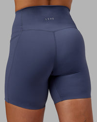 Woman wearing Abs Elixir Ultra High-Rise 6" Short Pockets - Nightshadow Blue | Thumbnail Index: 7