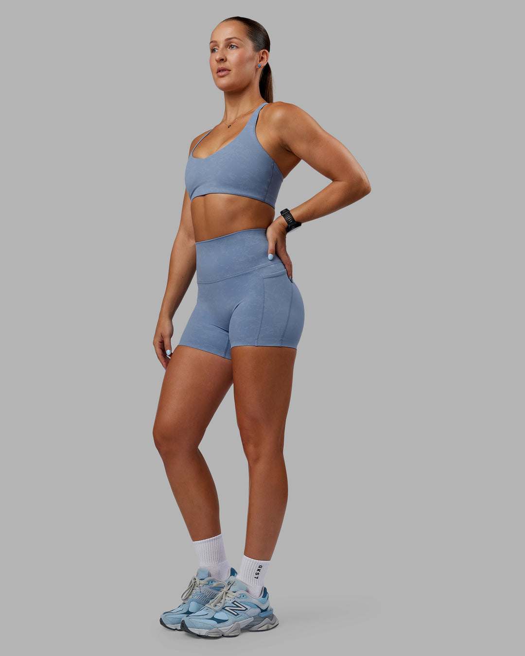 Woman wearing Abs Elixir Ultra High-Rise 4" Short Pockets - Infinity Mirage - view 3