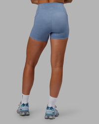 Woman wearing Abs Elixir Ultra High-Rise 4" Short Pockets - Infinity Mirage | Thumbnail Index: 3