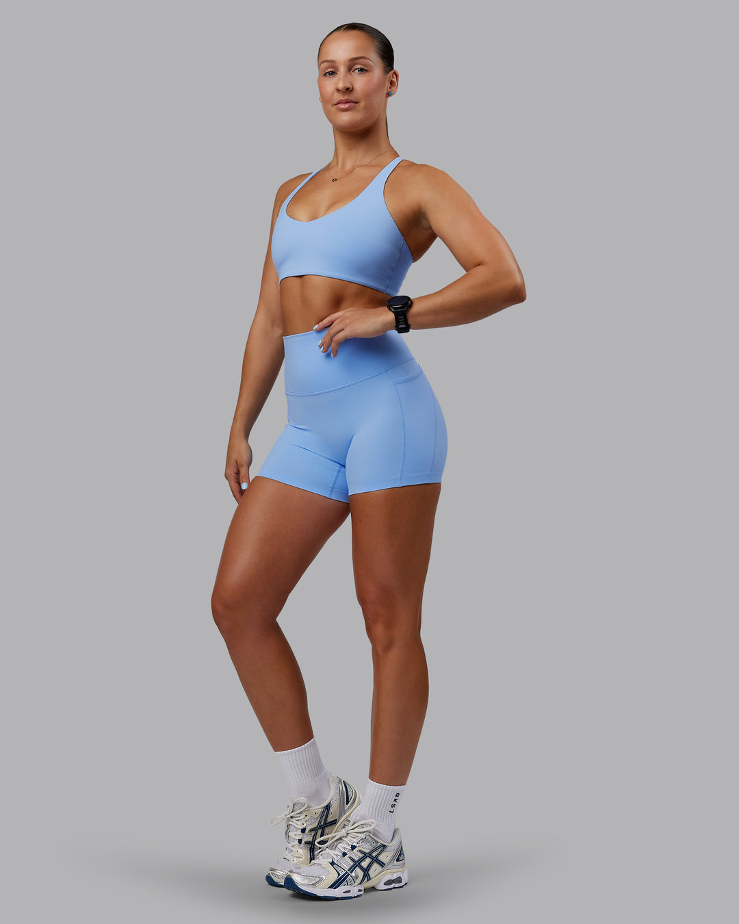 Woman wearing Abs Elixir Ultra High-Rise 4" Short Pockets - Open Air - view 4