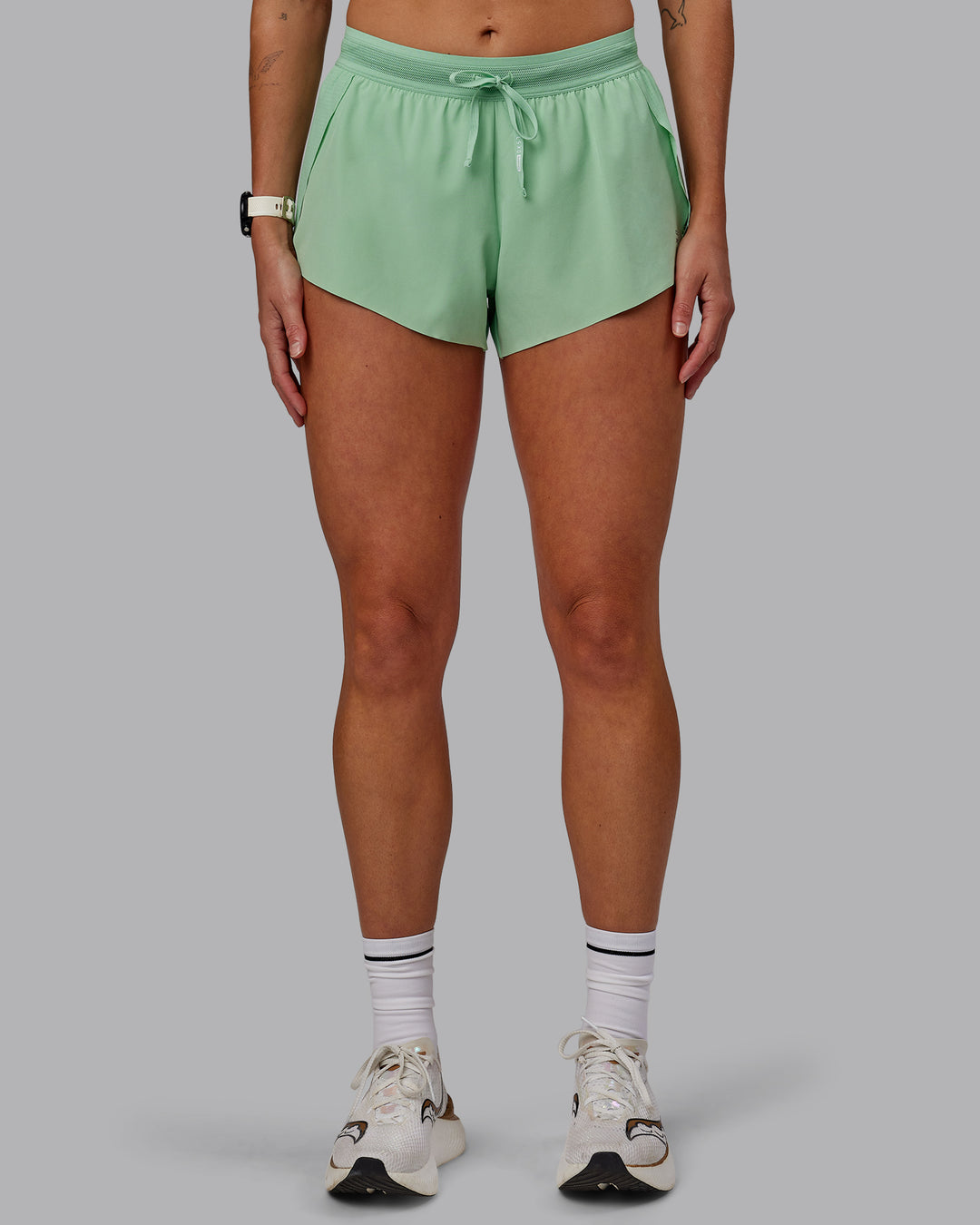 Woman wearing Accelerate 3" Run Shorts - Surreal Green - view 9
