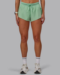 Woman wearing Accelerate 3" Run Shorts - Surreal Green | Thumbnail Index: 8