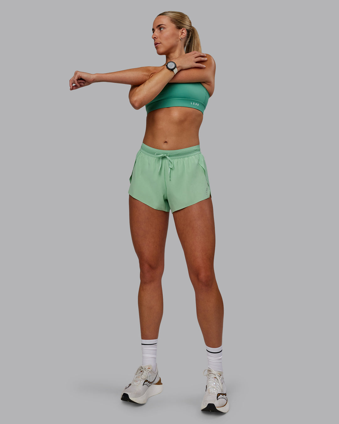 Woman wearing Accelerate 3" Run Shorts - Surreal Green - view 1