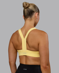 Woman wearing Advance Sports Bra - Lemon | Thumbnail Index: 1