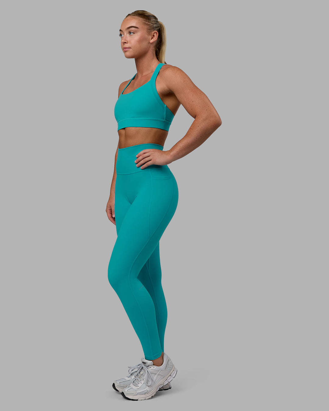 Woman wearing Advance Sports Bra - Uplift Blue - view 6
