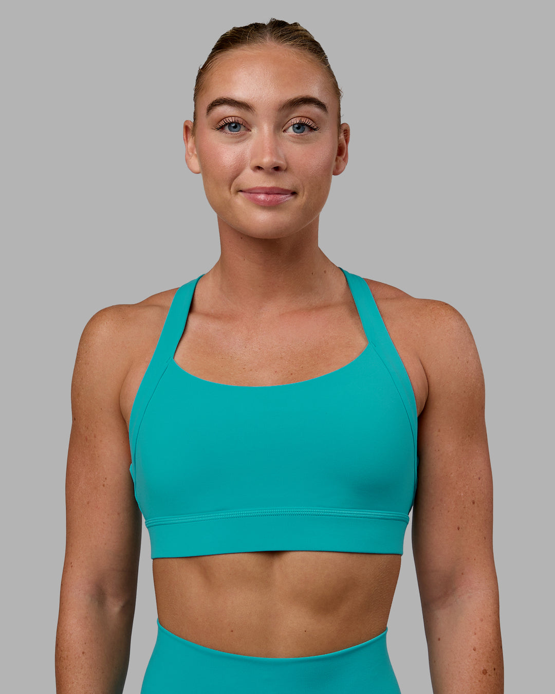 Woman wearing Advance Sports Bra - Uplift Blue - view 2