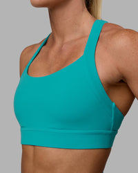 Woman wearing Advance Sports Bra - Uplift Blue | Thumbnail Index: 4