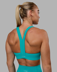 Woman wearing Advance Sports Bra - Uplift Blue | Thumbnail Index: 6