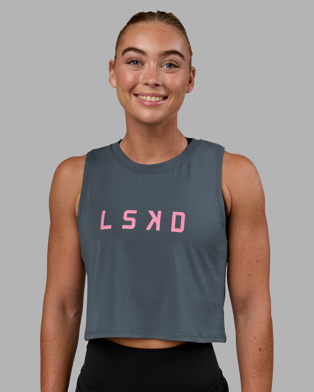 Woman wearing Agile FLXCotton Tank - Turbulence-Candy Pink - view 2