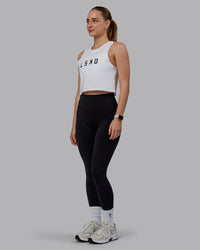 Woman wearing Agile FLXCotton Tank - White-Black | Thumbnail Index: 1