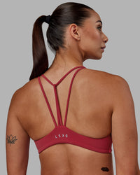 Woman wearing Agile Sports Bra - Claret | Thumbnail Index: 5