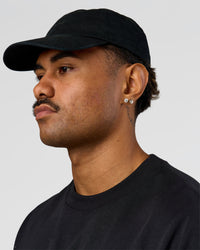 Man wearing All Day Cap in Black | Thumbnail Index: 0