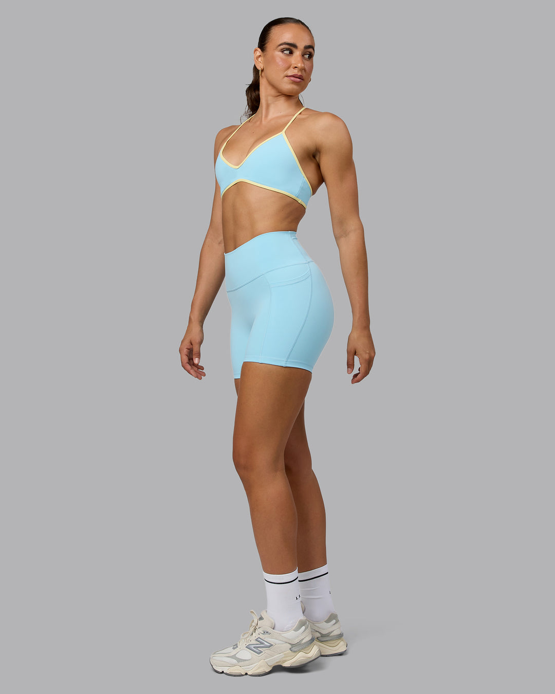 Woman wearing Ambience Sports Bra - Crystal Blue-Lemon - view 3