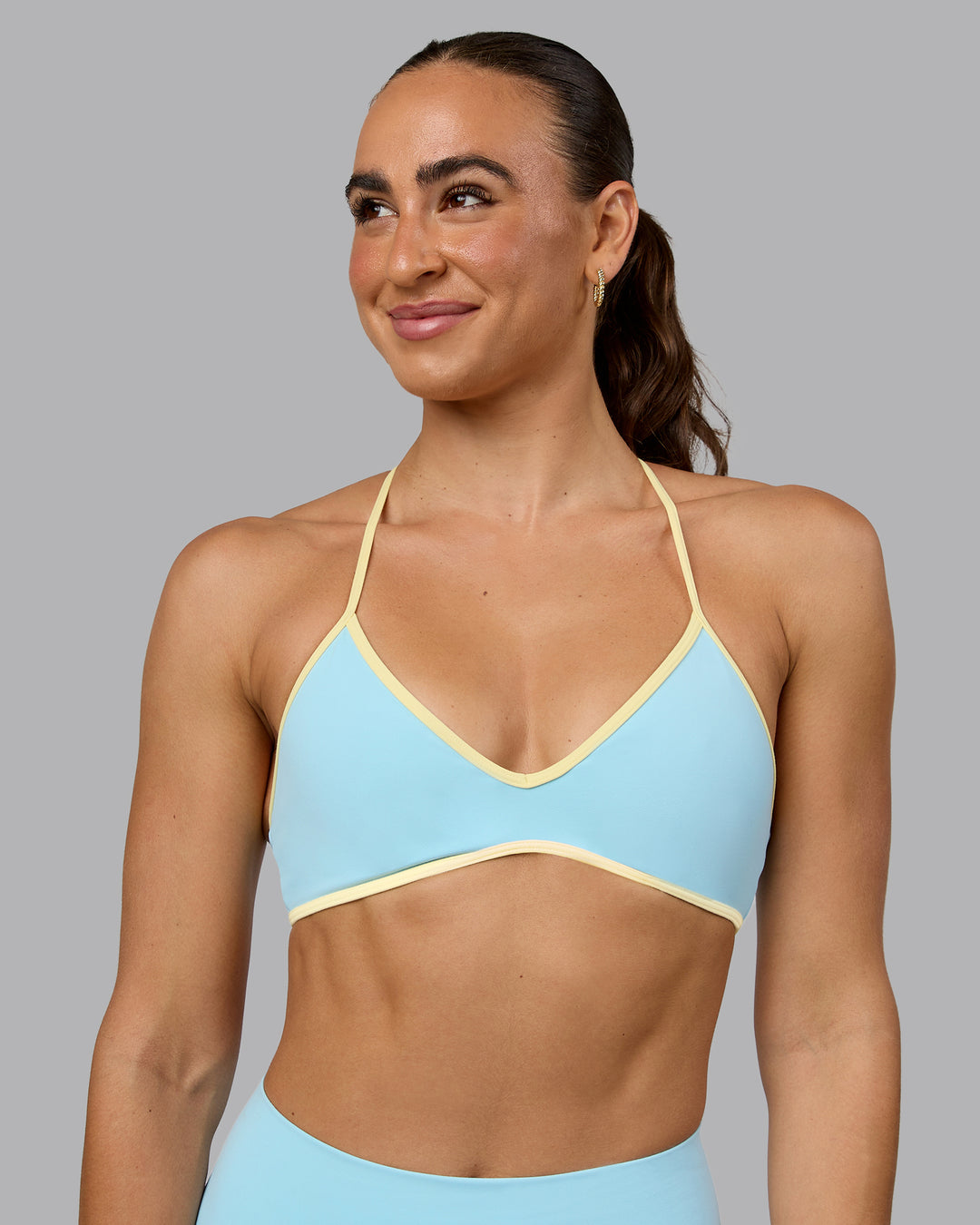 Woman wearing Ambience Sports Bra - Crystal Blue-Lemon - view 1