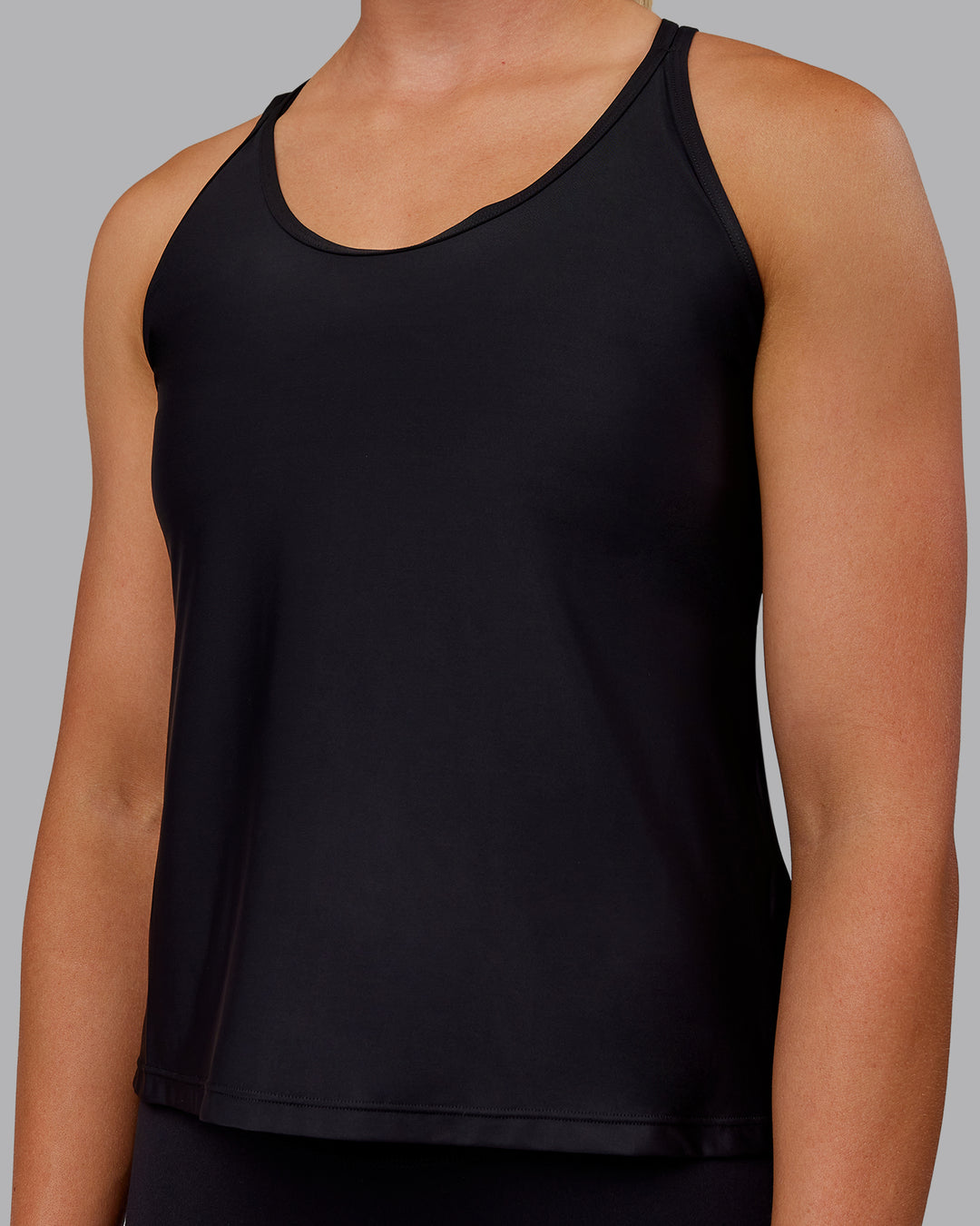 Woman wearing Apex Lightweight Performance Tank - Black - view 4