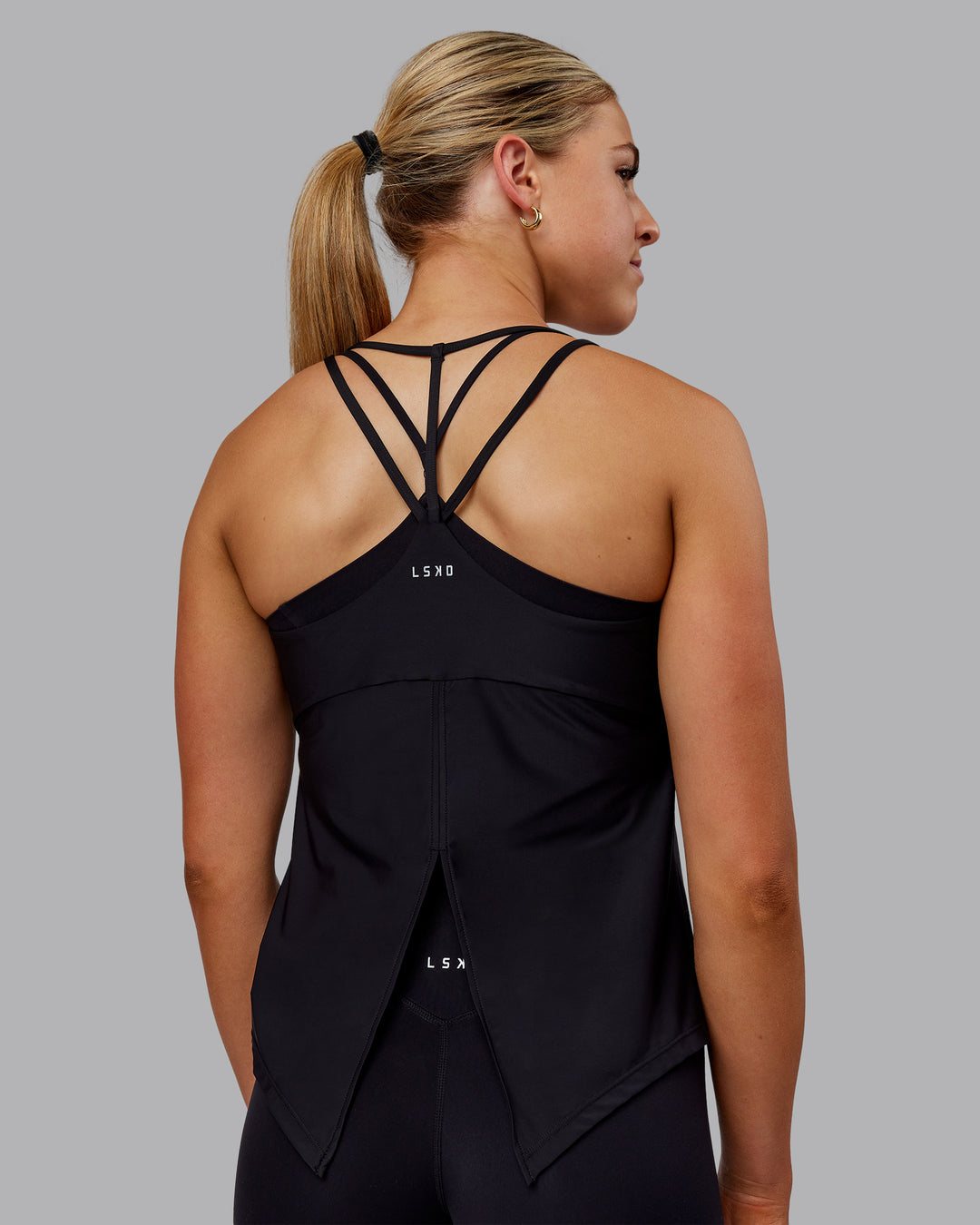 Woman wearing Apex Lightweight Performance Tank - Black - view 2