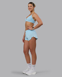 Woman wearing Ascend Sports Bra - Crystal Blue | Thumbnail Index: 3