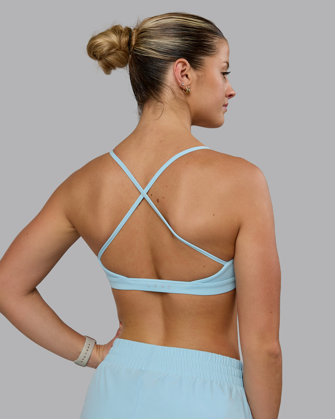 Woman wearing Ascend Sports Bra - Crystal Blue - view 2