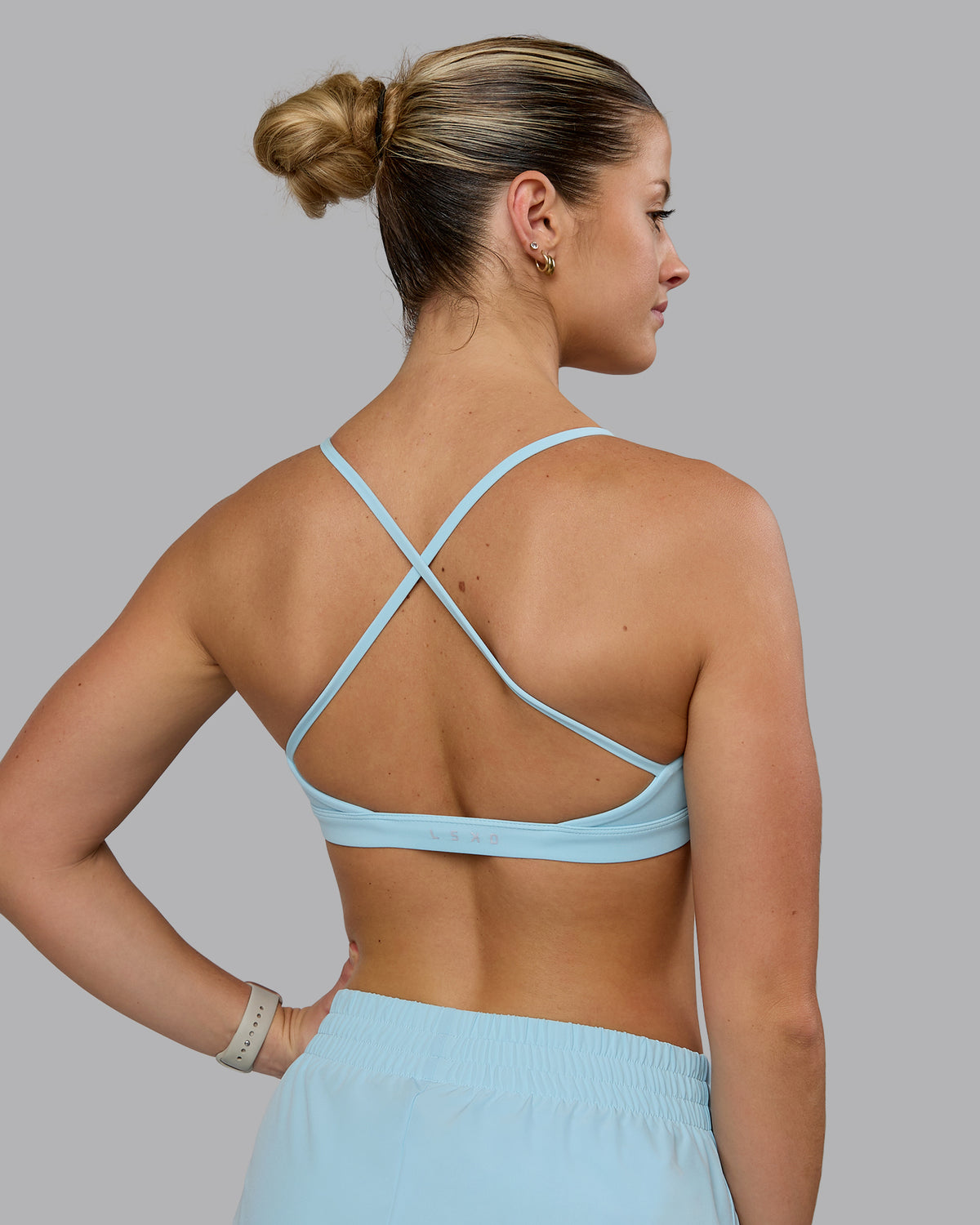 Woman wearing Ascend Sports Bra - Crystal Blue
